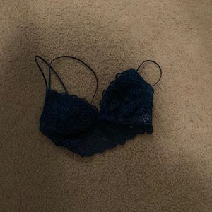 It’s a bralette. It is a green ish blue, and small.